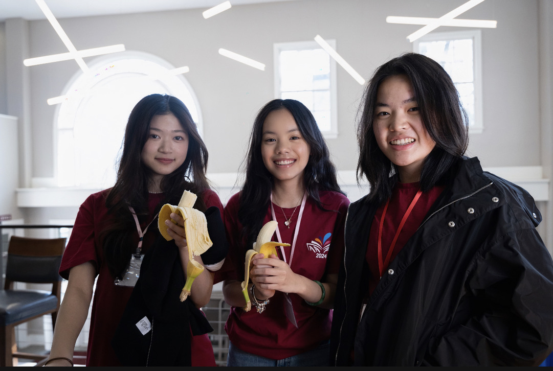 Bella laughing with friends at the Asian American Footsteps Conference