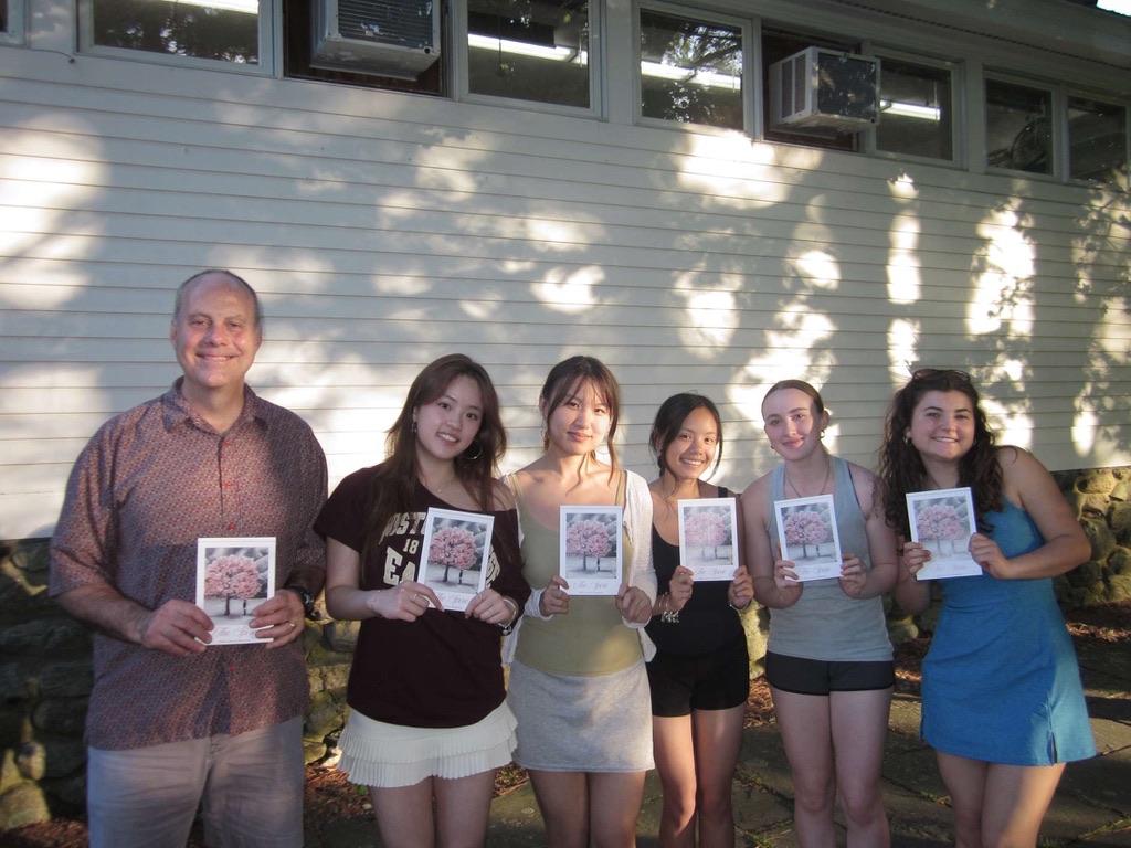 Bella and The Spire staff holding the new issue