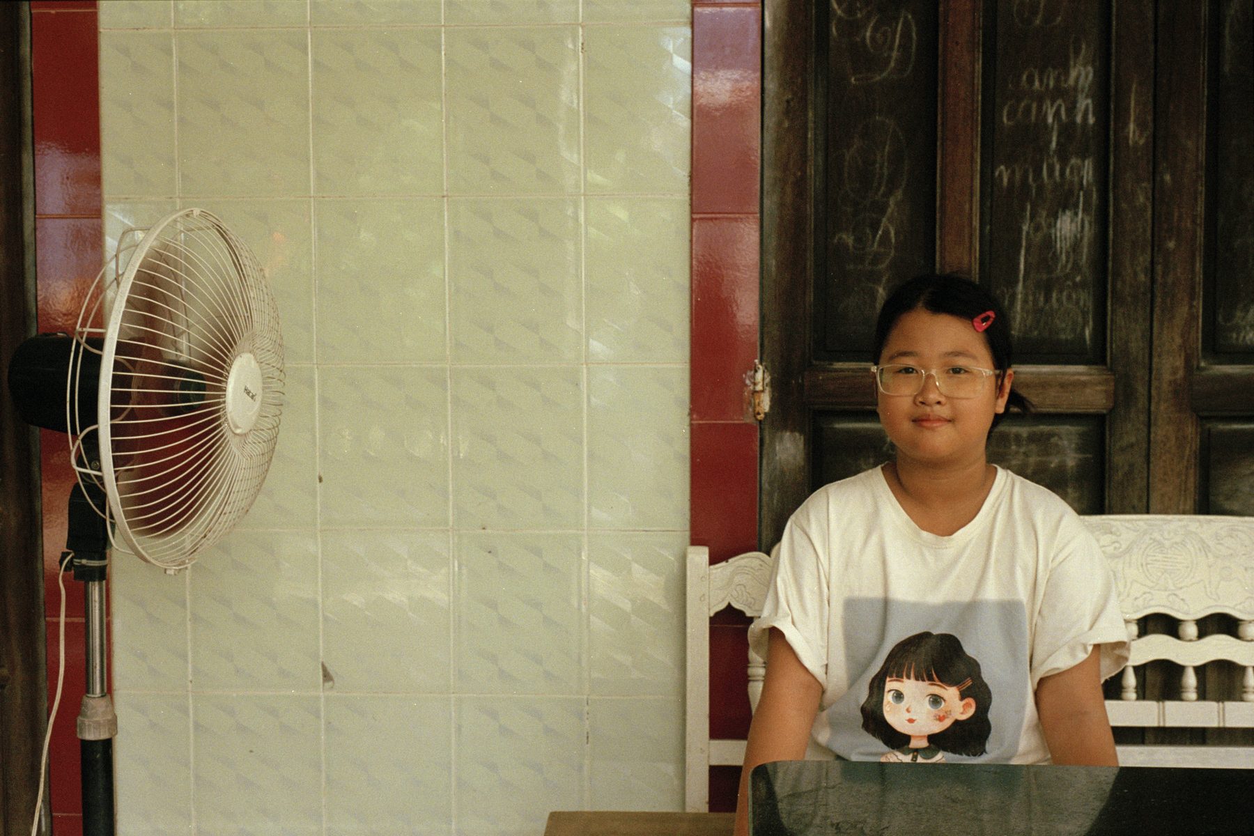A Phu Hai student photographed at home in Hue